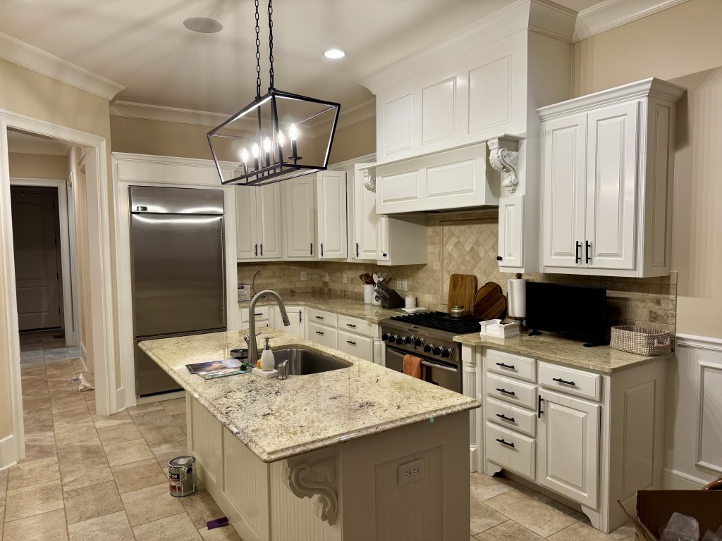 kitchen cabinets professionally repainted in white by Glenny's Painting in Charlotte